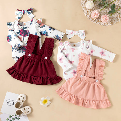 Baby girl wearing premium pink ruffle romper set with coordinated floral dress and matching headband, 3-piece coordinate set by Kazarenok Kids